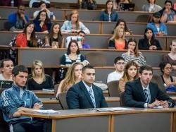 Students attending a session in their business attire.